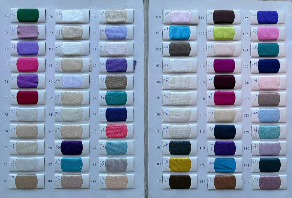 Swatch chart showcasing various fabric colors for customizable wedding dresses, including shades of purple, blue, and neutral tones.