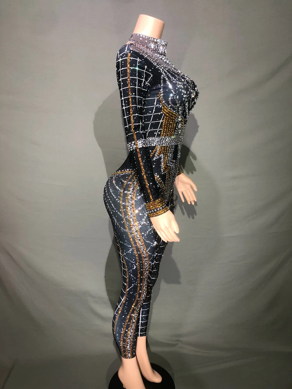 Side view of a rhinestone jumpsuit, stylish stage outfit for dancers and performers, showcasing black and silver accents.