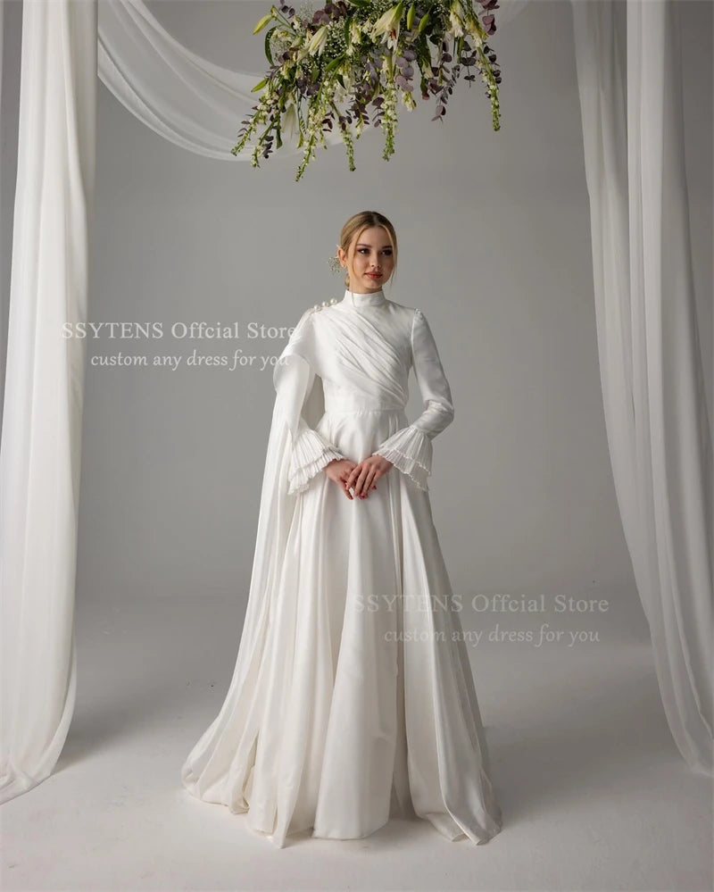 Elegant Muslim satin wedding dress featuring pearls, high neck, and long sleeves, perfect for any age.