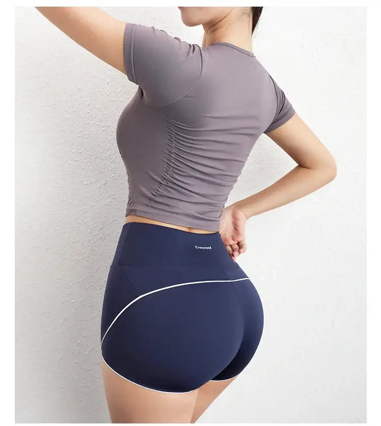 قميص رياضي نسائي ضاغط بأكمام قصيرة بدون درزات