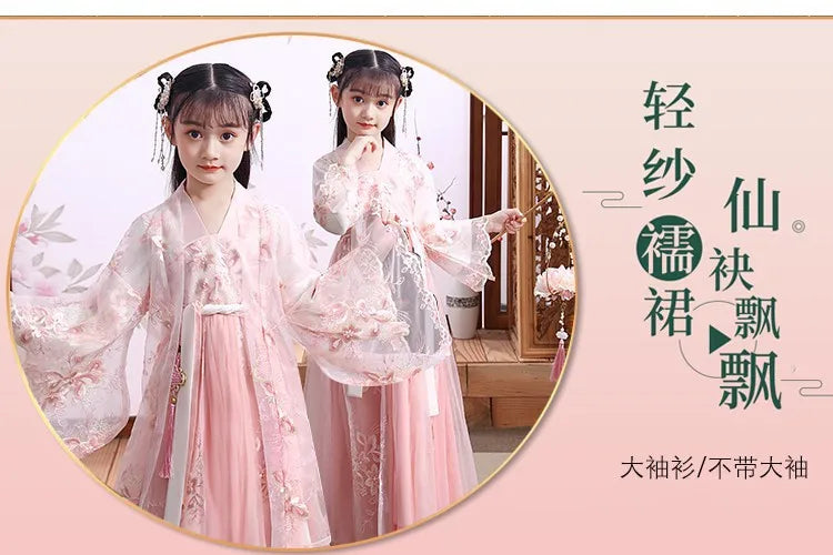 Girls in a pink Chinese Hanfu cosplay dress, showcasing delicate embroidery and flowing sleeves for a fairy-like appearance.