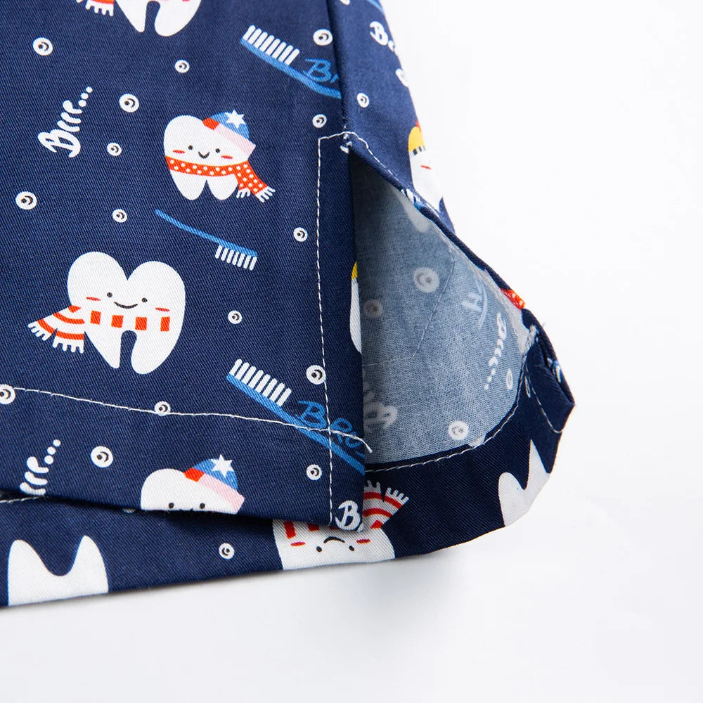 Close-up of colorful tooth-themed fabric on women's nurse scrubs, ideal for medical and beauty professionals.