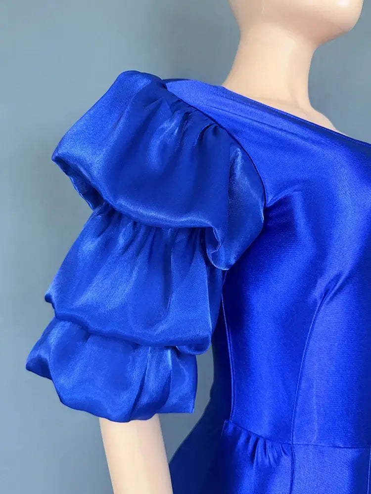 جمبسوت نسائي للحفلات بأكمام منتفخة من الساتان