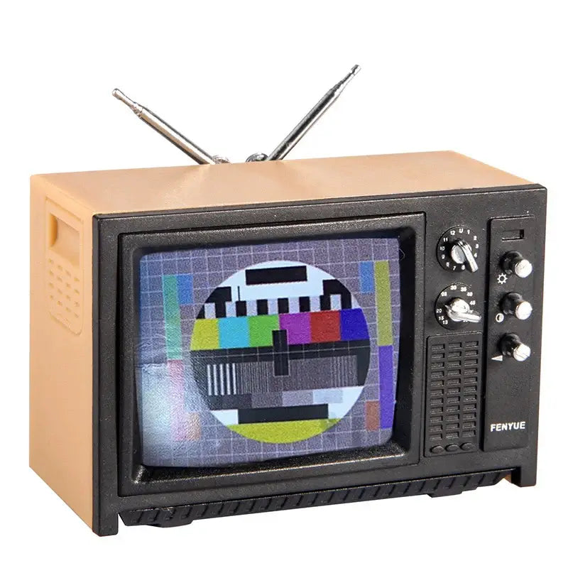 Vintage mini television model featuring a test pattern and adjustable antennas, ideal for retro-themed decor.