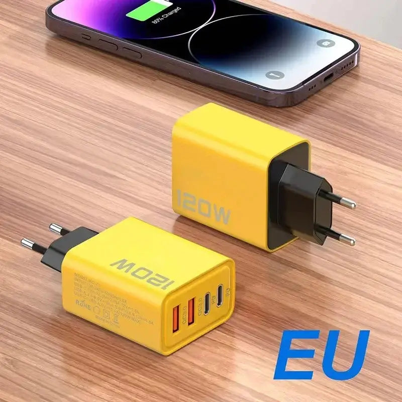 120W USB Type C fast charger in yellow, designed for quick charging of all devices, placed next to a smartphone showing charging status.