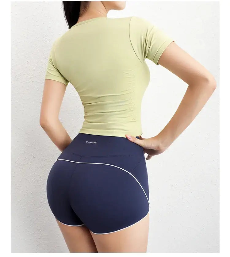 قميص رياضي نسائي ضاغط بأكمام قصيرة بدون درزات