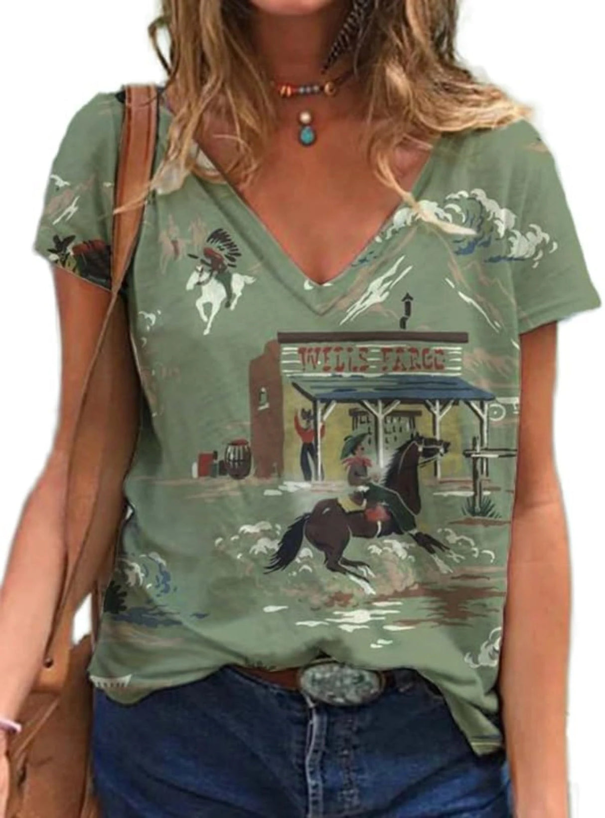 Western Cowgirl Graphic T-Shirt featuring a vintage horse and cowboy design on a green V-neck top.