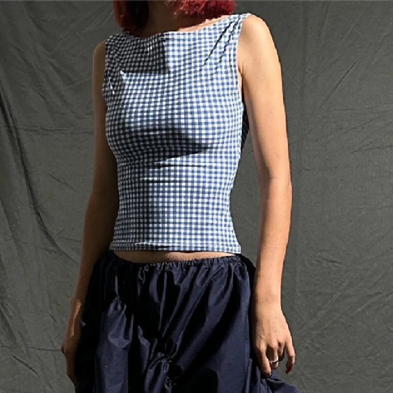 Woman wearing a stylish plaid blue crop top, ideal for Y2K streetwear fashion.