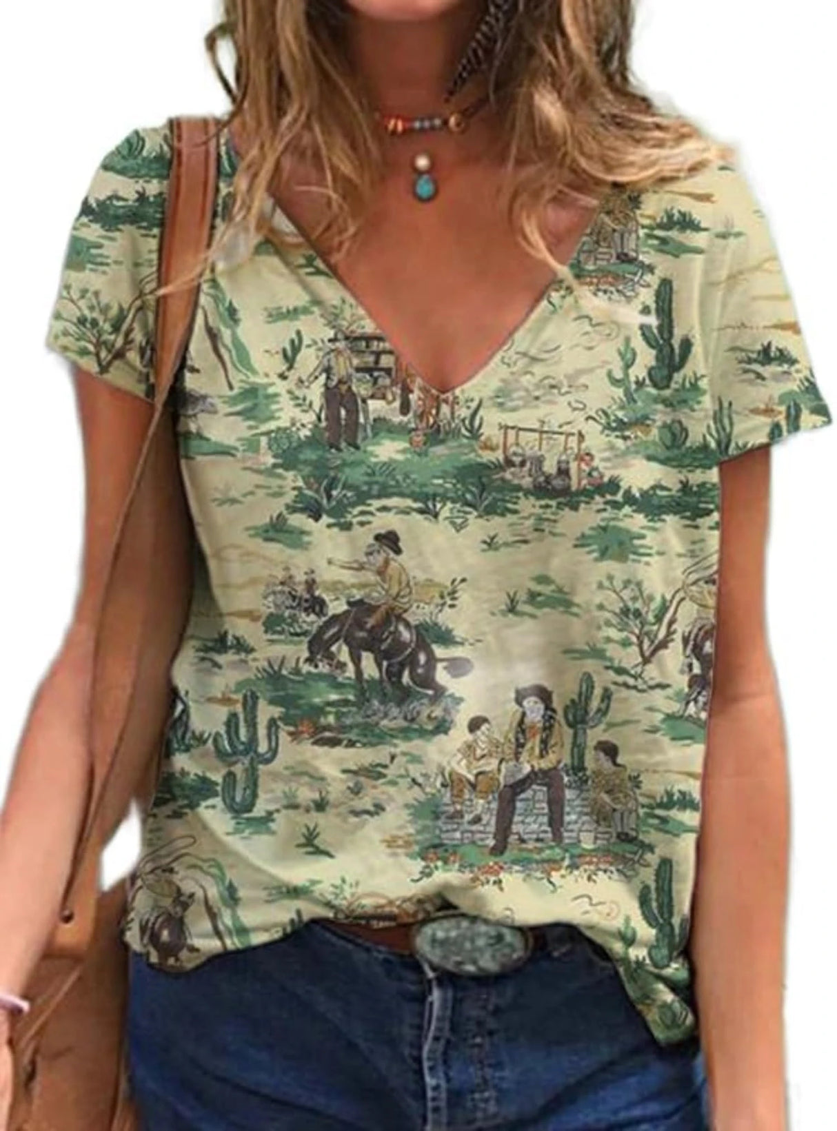 Western cowgirl graphic T-shirt featuring a vintage western scene with cacti and cowboys, perfect for casual wear.