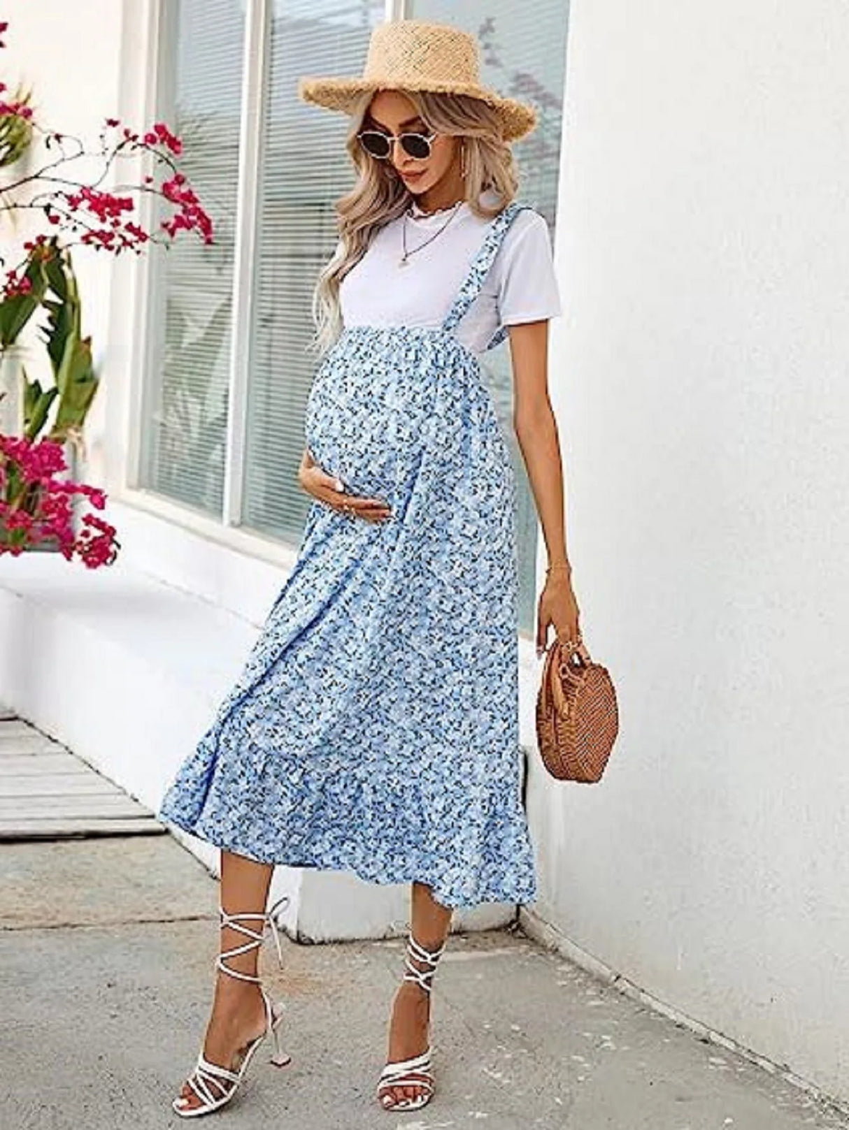Stylish summer dress for maternity, featuring a blue floral pattern and a comfortable fit for expecting mothers.