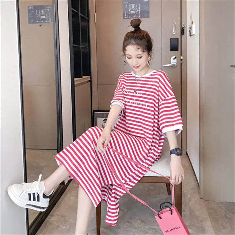 Striped maternity dress in red and white, showcasing a loose fit and casual style for summer wear.