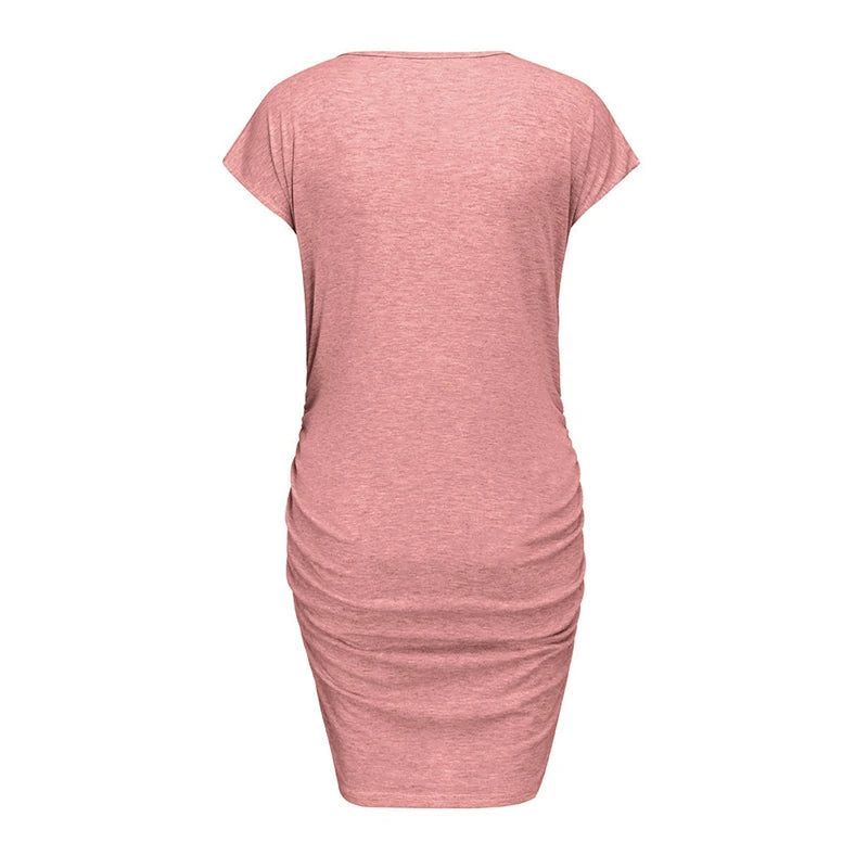 Back view of a loose casual maternity dress for plus size women, featuring a pink color and above-knee length.