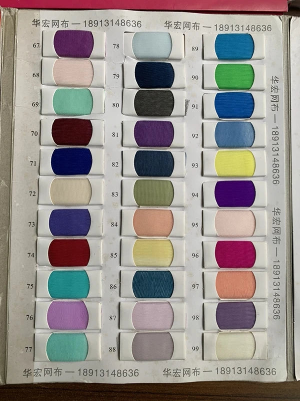 Color swatch chart displaying a variety of fabric shades, including purples, greens, blues, and browns.