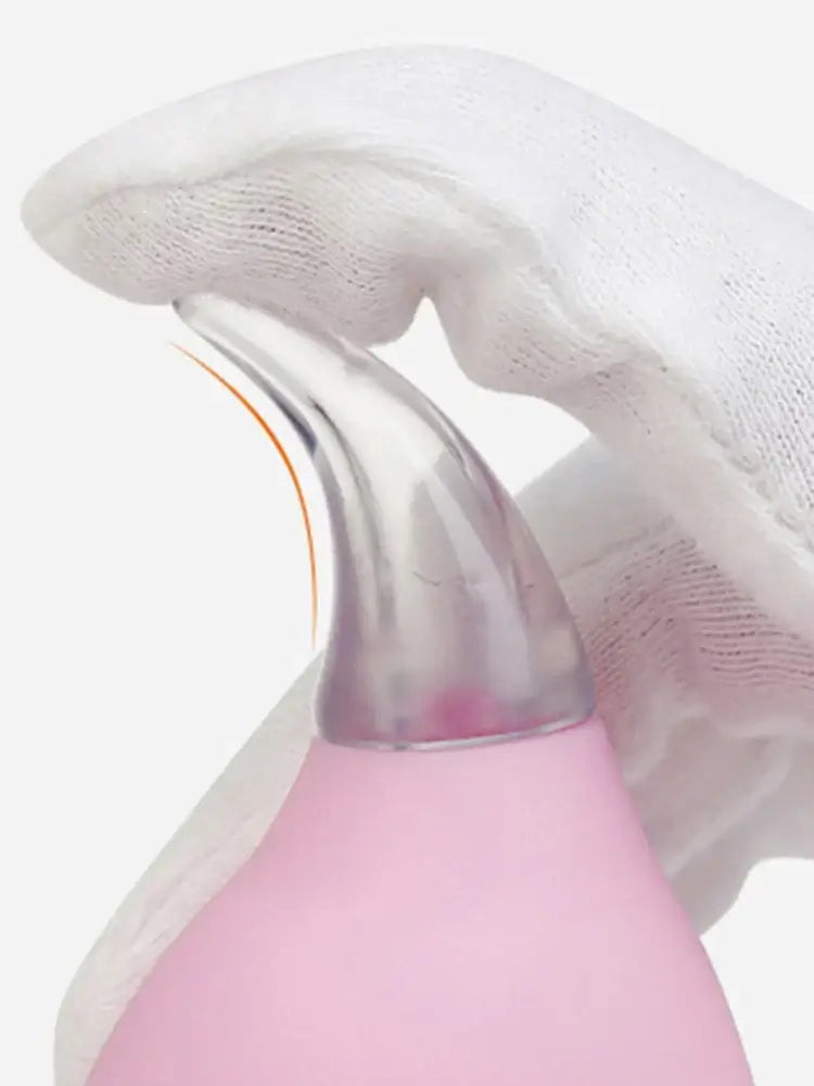 Close-up of a hand holding a Kids Nasal Aspirator Waterdrop with a pink design, demonstrating baby care tool use.