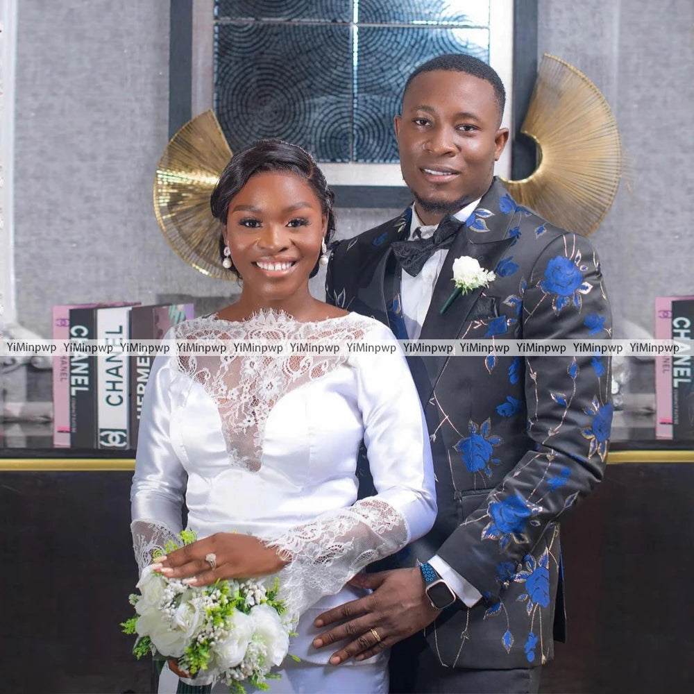 Bride and groom posing together, showcasing elegance with floral bouquet and stylish wedding attire.