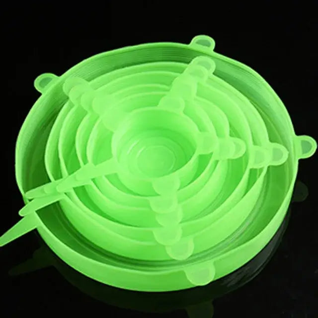 Set of 6 green silicone stretch lids for kitchen and microwave use, perfect for food storage and preserving freshness.