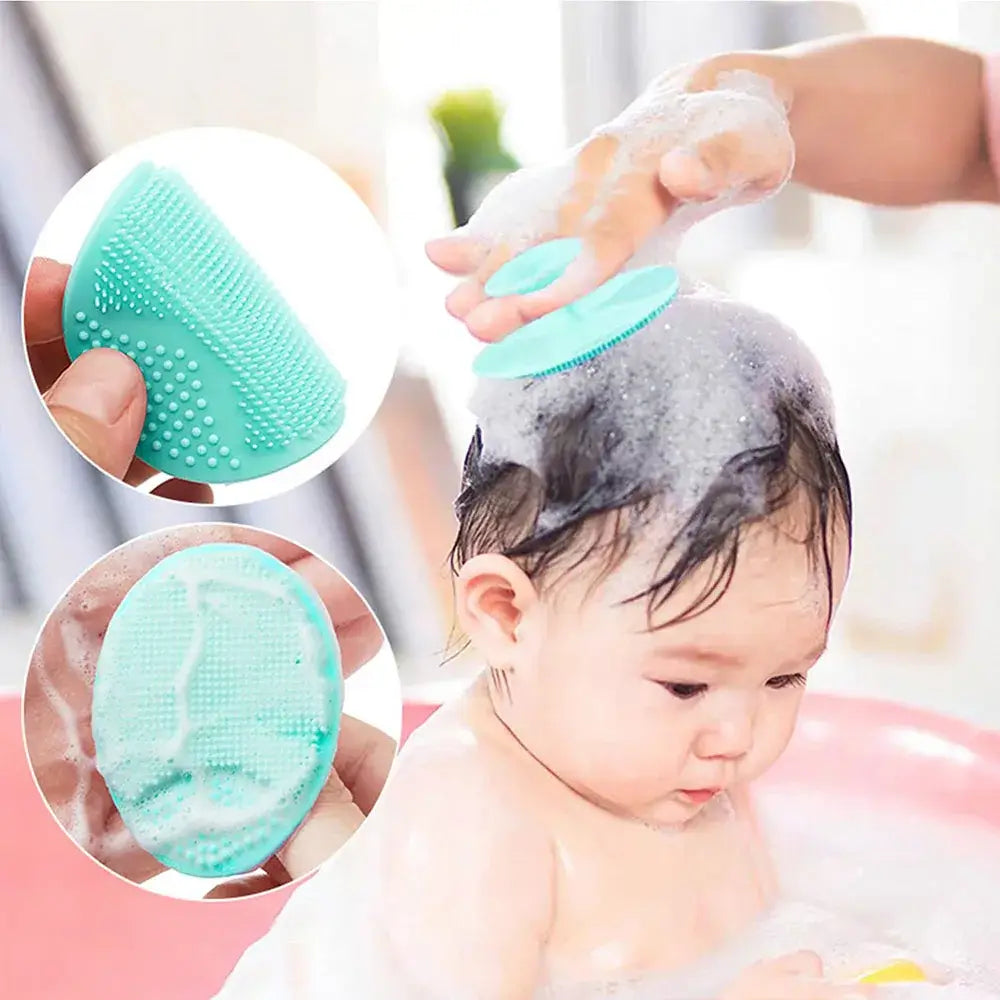 Baby silicone bath brush in use during bath time, perfect for gentle shampooing and baby care.