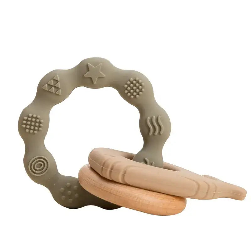 Soft silicone baby teether in neutral colors, perfect for soothing sore gums during teething.