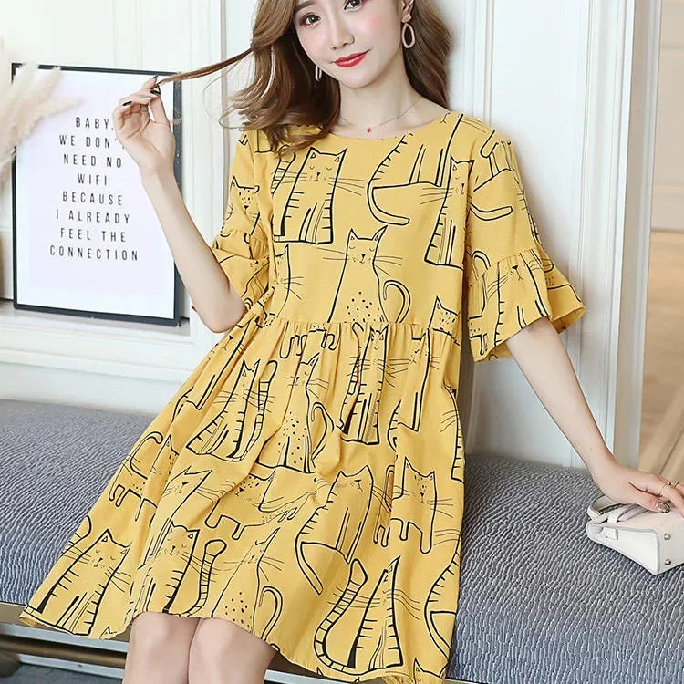 Loose Korean cartoon cat maternity dress with short sleeves in yellow, featuring a playful cat print, perfect for summer fashion.