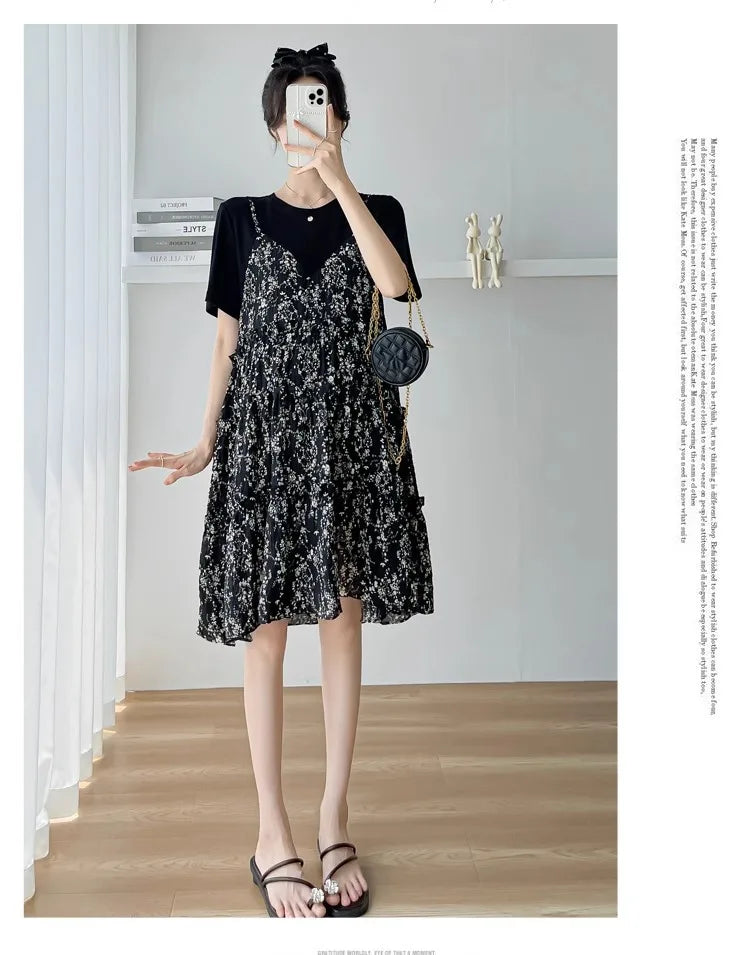 Elegant black floral maternity dress with short sleeves and tiered design, perfect for summer baby showers.
