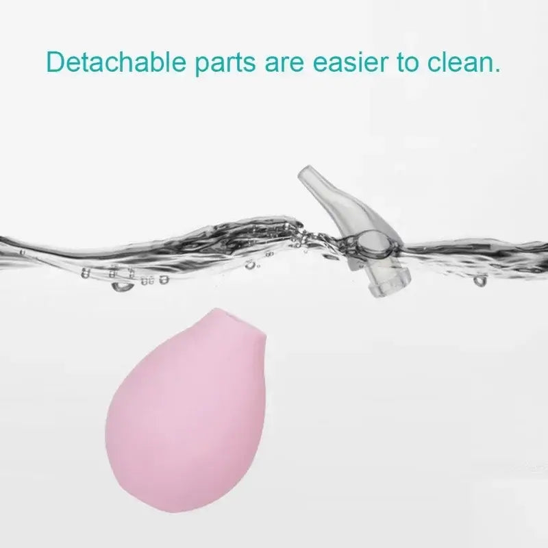 Nasal aspirator parts submerged in water, highlighting easy cleaning with detachable components.