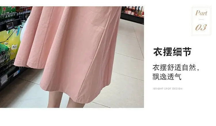 Close-up of pink Korean loose fit maternity dress, showcasing its flowy mid-calf design and soft fabric.