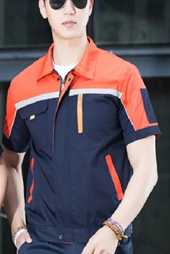 Man wearing a short-sleeve navy and orange breathable coverall, ideal for workshop and mechanic use.
