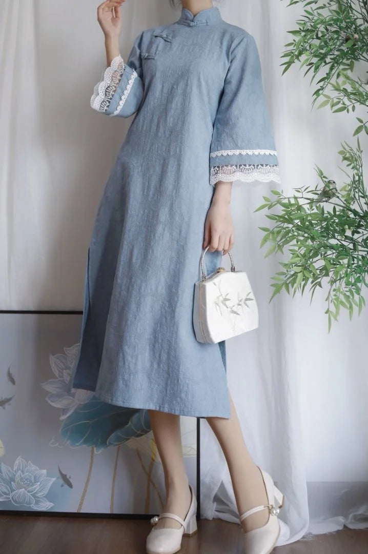 Stylish blue cotton Jacquard Cheongsam dress with lace sleeves, elegant design, perfect for casual or formal occasions.