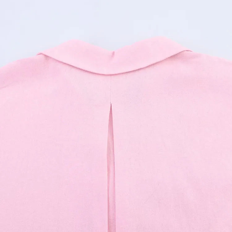 Back view of a pink AsymLinen™ wide sleeve linen shirt featuring a turn-down collar and a stylish split design.