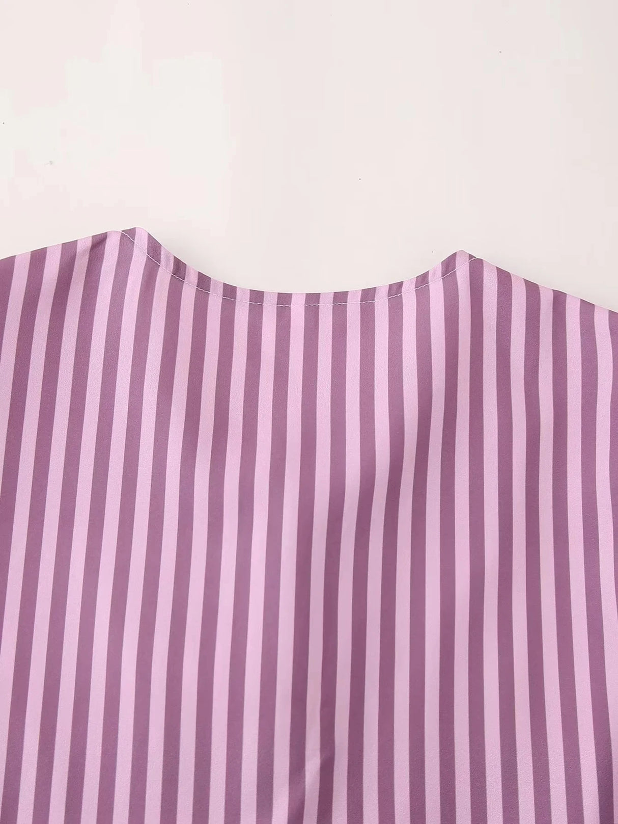 BowChic™ Stripe Lace-Up Blouse in purple with thin vertical stripes, showcasing O-neck design and elegant short sleeves.