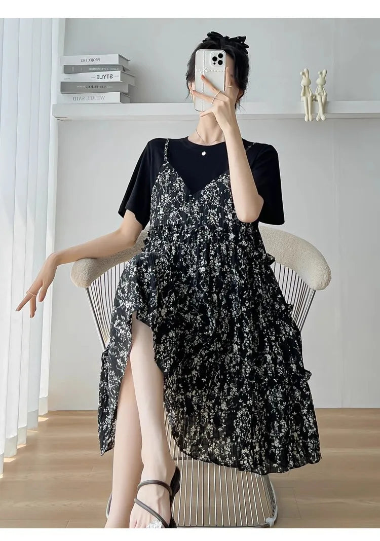 Chic black floral maternity dress with ruffles, worn over a black t-shirt, perfect for summer outings and baby showers.