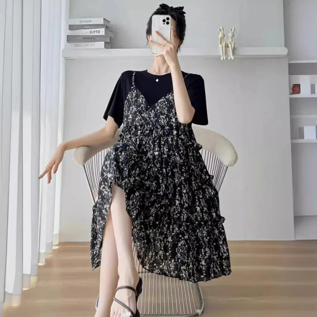 Elegant black floral maternity dress with ruffles, styled for summer wear, perfect for baby showers.