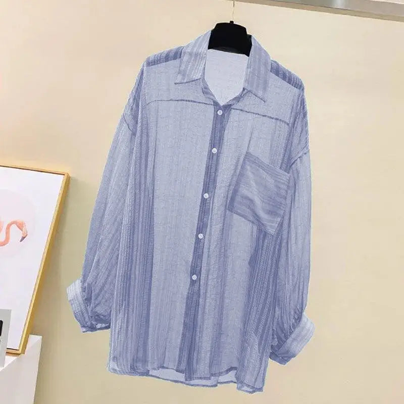 Lightweight sheer chiffon shirt in blue, featuring a loose fit and single-breasted front, ideal for spring and summer.