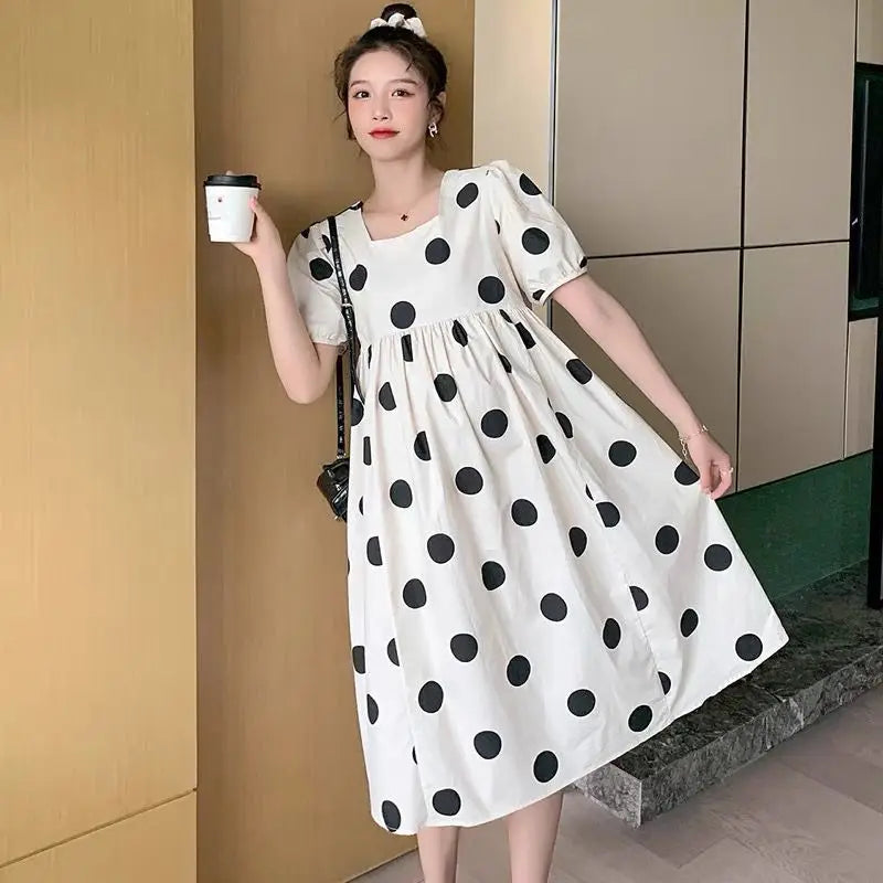 Polka dot loose maternity dress by YIGUDAR, mid-calf length, stylish summer outfit for women in cotton and polyester.