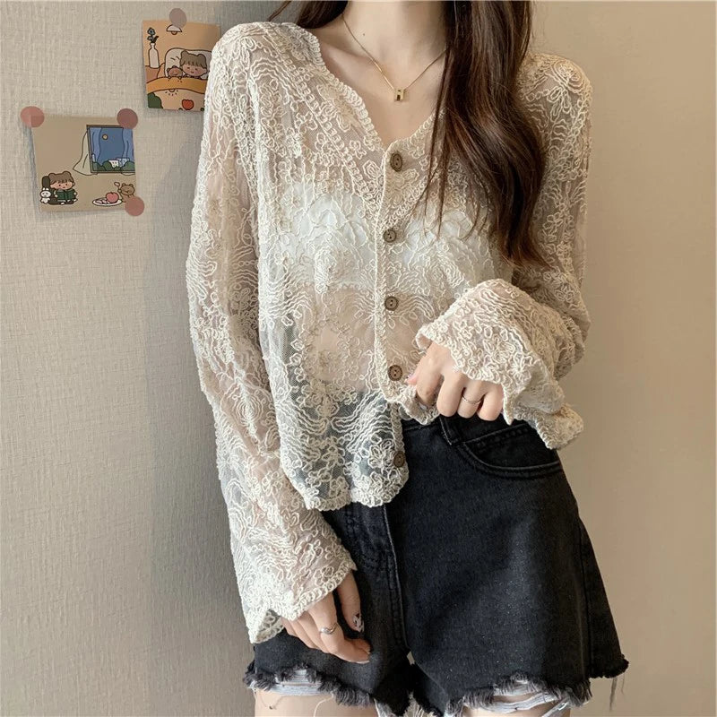 SheerCharm™ lace sun shirt in beige, featuring long sleeves and a loose fit, styled with shorts.