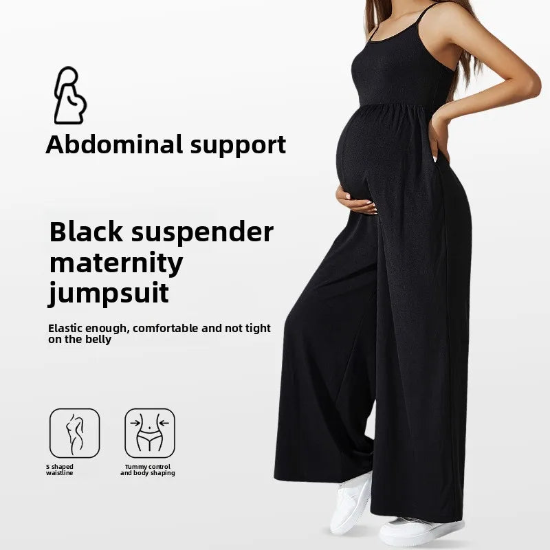 Black suspenders maternity jumpsuit featuring abdominal support, elastic fit, and comfortable design for expecting mothers.