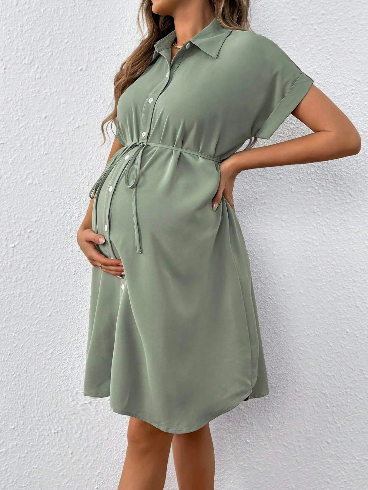 Light green striped button shirt maternity dress perfect for casual summer days, featuring tie waist and short sleeves.