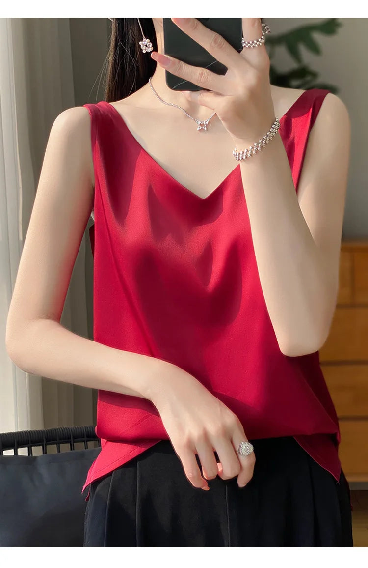 Elegant red satin V-neck camisole worn by a woman, showcasing summer fashion and effortless style.