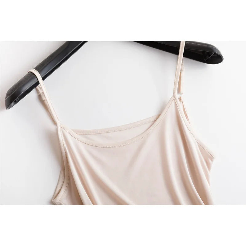 SilkAura™ silk blend knit camisole in soft beige hanging on a black hanger, perfect for summer lingerie.