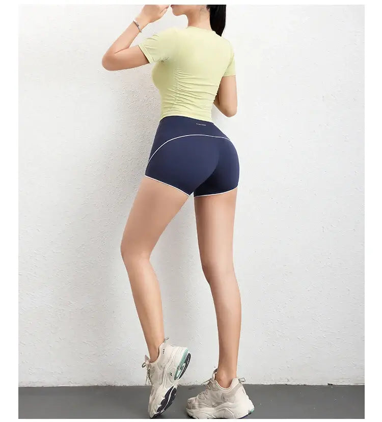 قميص رياضي نسائي ضاغط بأكمام قصيرة بدون درزات