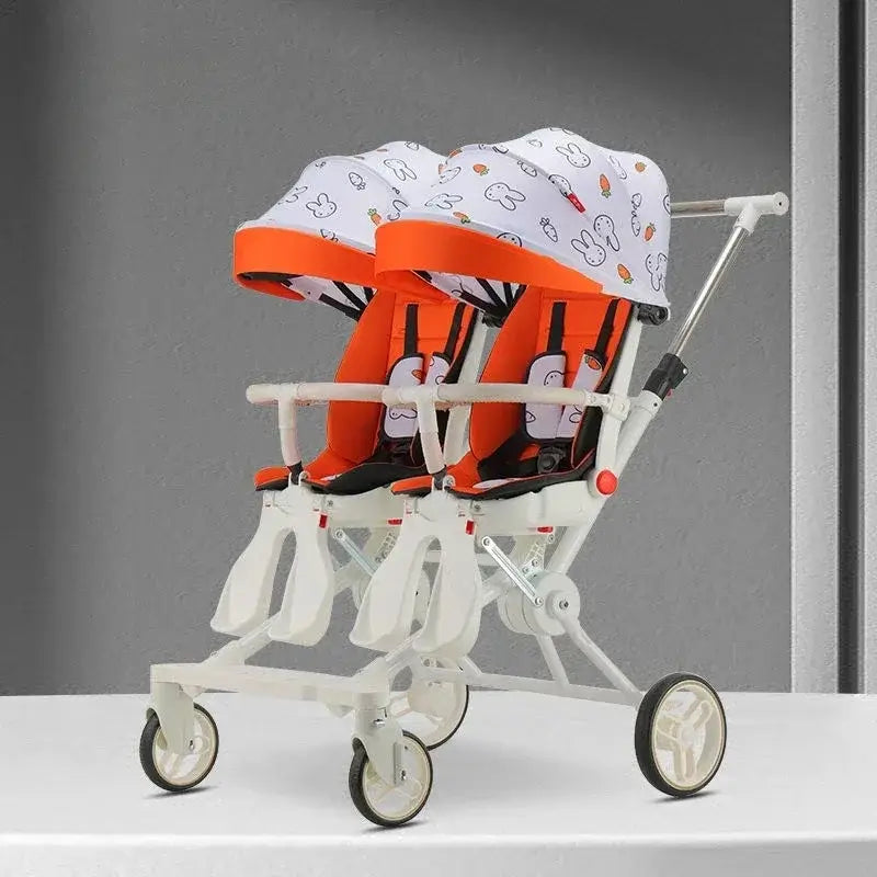 Twin stroller with orange hoods for two children, designed for ages 6 months to 3 years, featuring foldable high-carbon steel frame.