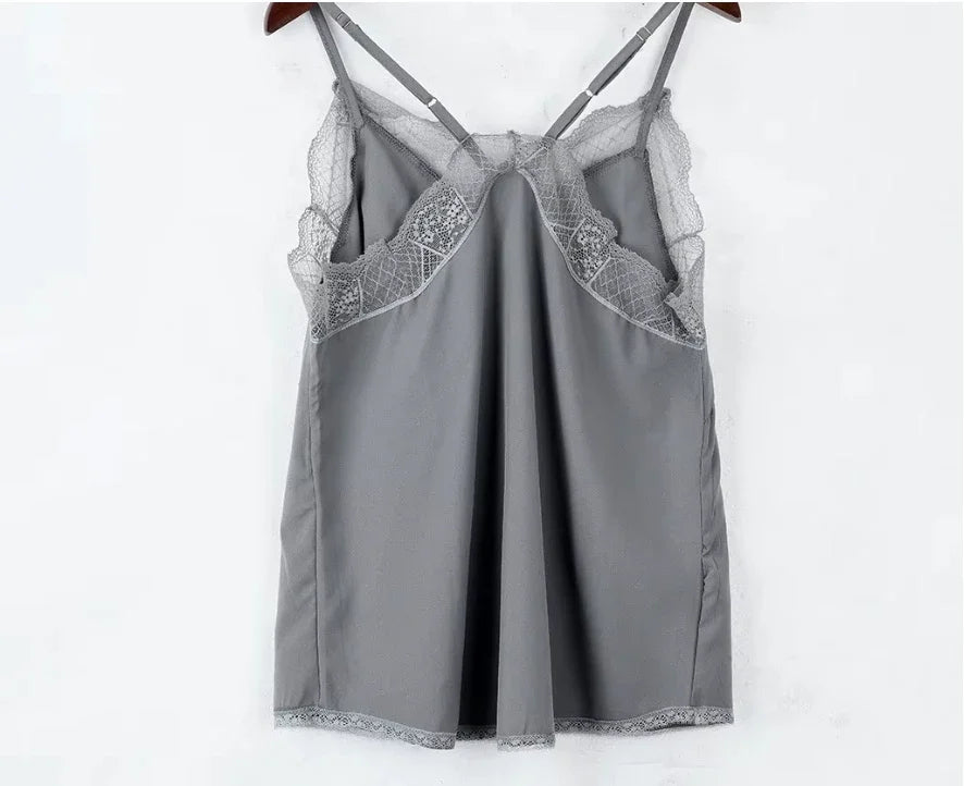 Elegant grey satin camisole with lace detail and adjustable straps, perfect for clubwear and casual occasions.