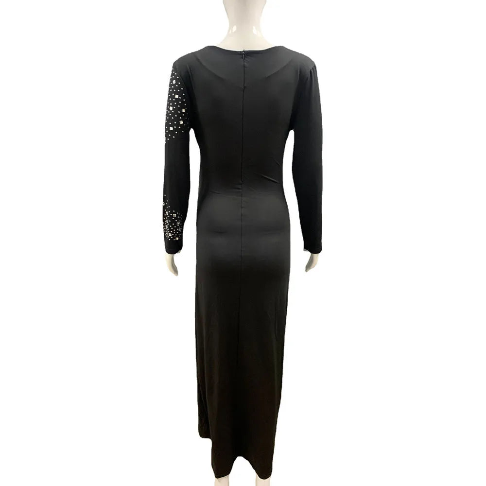 Elegant black ankle-length maternity dress with full sleeves and embellished details, perfect for summer photography.