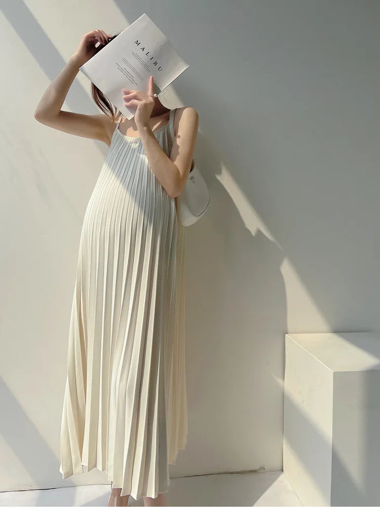 Pleated chiffon maternity dress in natural color with mid-calf length, ideal for summer wear.