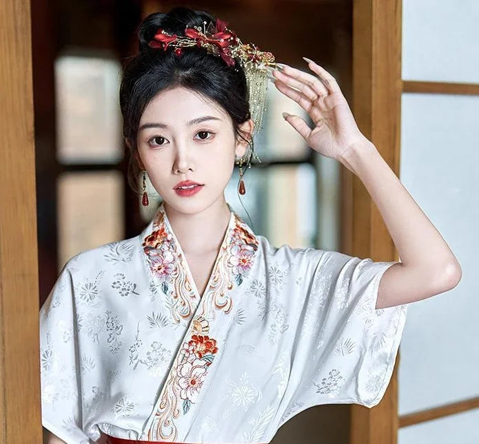 Elegant woman wearing a Traditional Hanfu oversized embroidered blouse with floral designs, showcasing cultural beauty.
