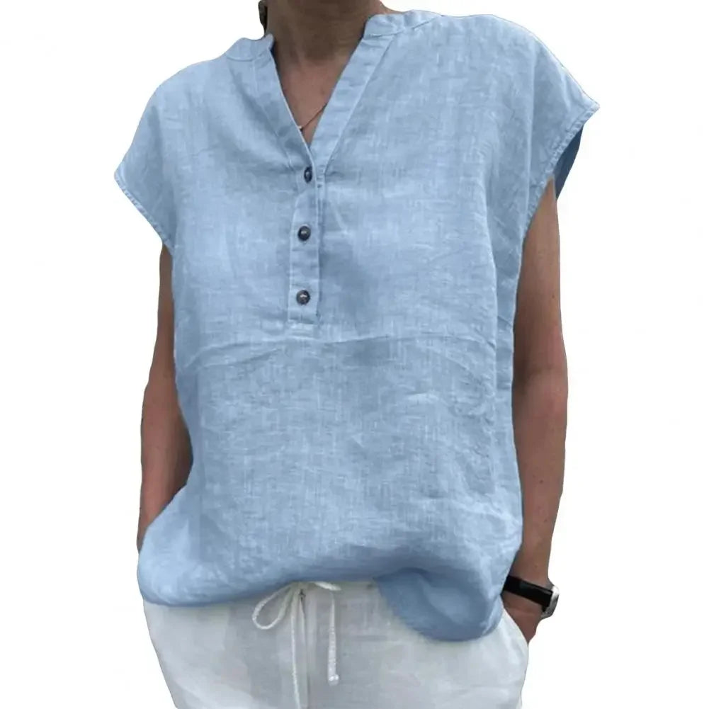 Light blue cotton linen V-neck blouse with button closure, perfect for summer wear.