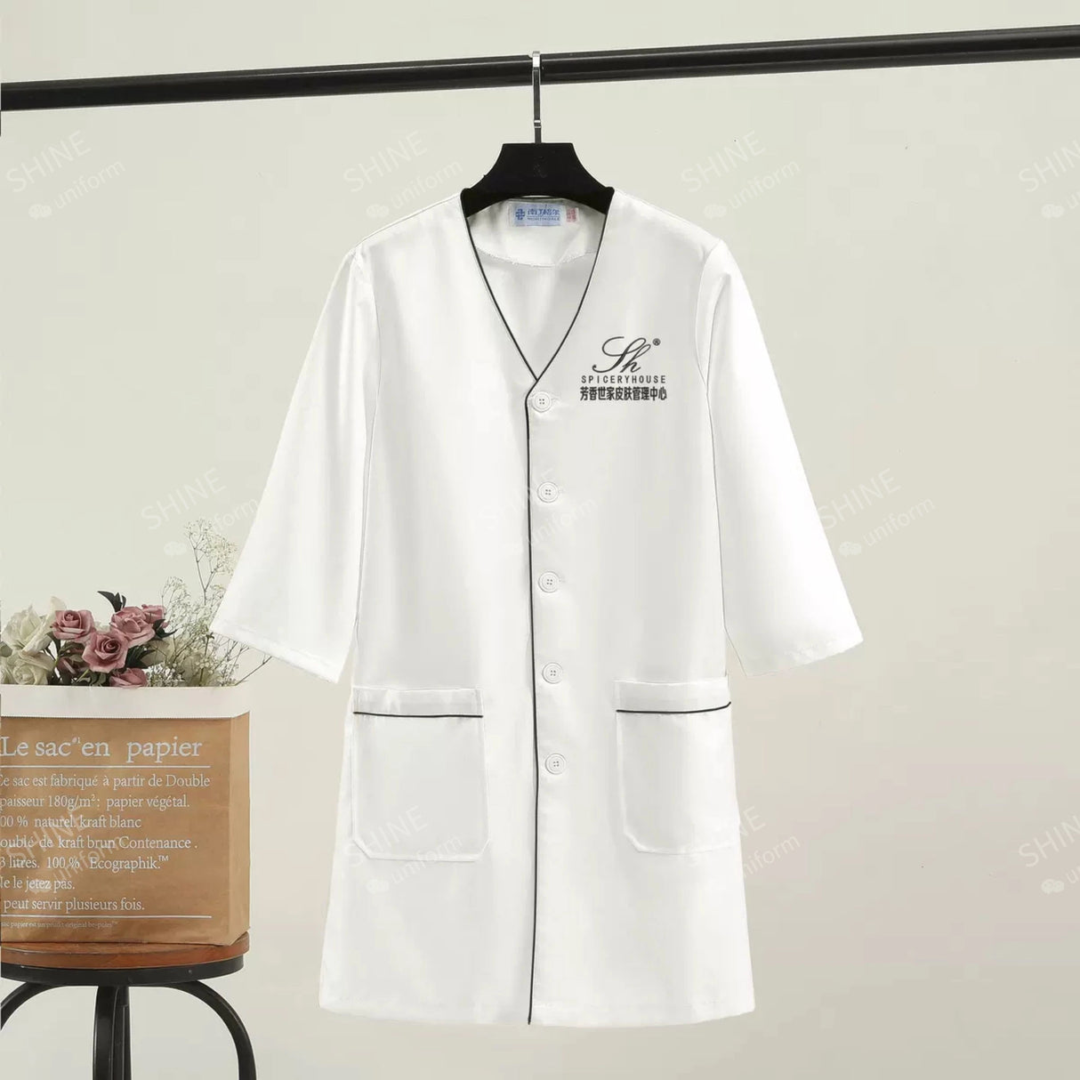 Custom white short sleeve lab coat for spa and beauty professionals with pockets, women's beauty uniform.