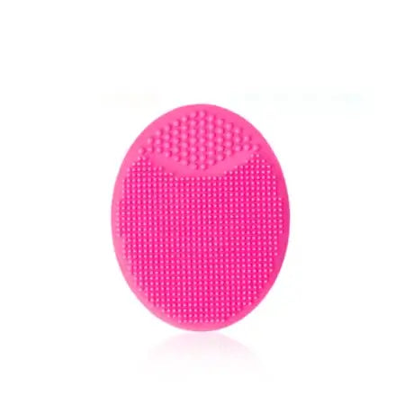 Pink silicone baby shampoo brush designed for gentle cleaning during bath time.
