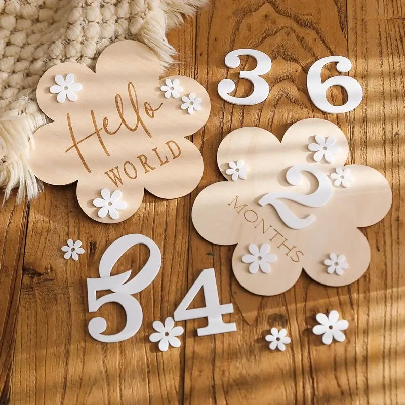 Wooden baby milestone set featuring flower shapes, numbers, and floral accents for tracking growth, ages 0-6 months.