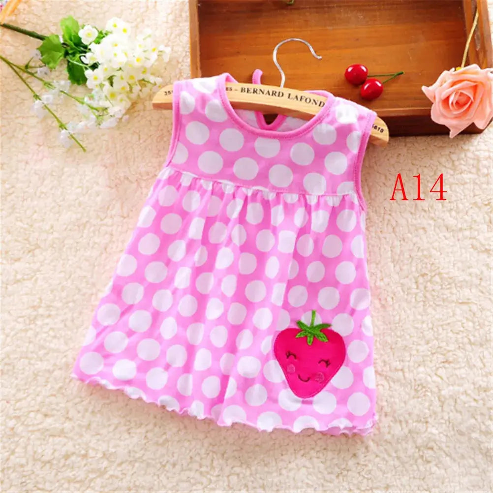 Cute pink polka dot sleeveless dress for baby girls featuring a strawberry design, perfect for summer. Age 0-2 years.